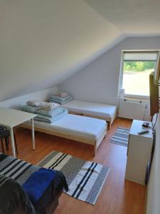 a living room with a couch and a table at Zakątek Pod Lasem in Wydminy