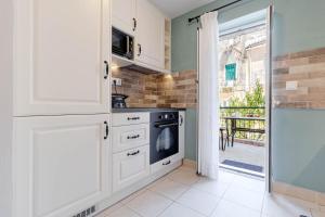 A kitchen or kitchenette at Cozy Corfiot house