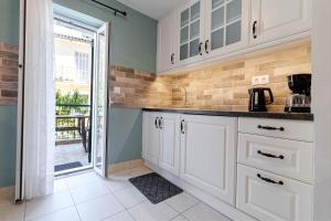 A kitchen or kitchenette at Cozy Corfiot house