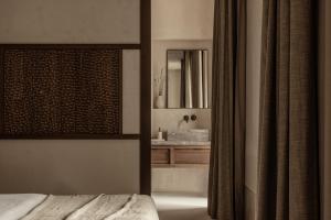 Voodi või voodid majutusasutuse MANNA, a Member of Design Hotels toas
