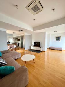 a living room with a couch and a table at Villa Plaža in Zavala