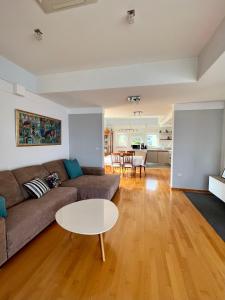 a living room with a couch and a table at Villa Plaža in Zavala