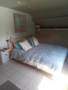 a large bed in a room with at On dirait le Sud 