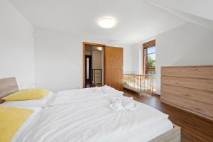 Postel nebo postele na pokoji v ubytování Apartmány v Říčkách - Apartmány V Klidu a V Pohodě