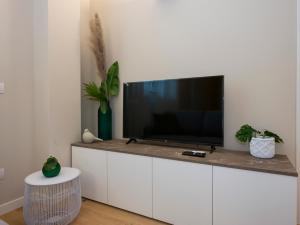 Телевізор і / або розважальний центр в I Host Apartment - Ranzoni 2