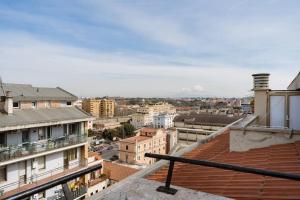 a view of a city from the roof of a building at Roman Rooftop 1 in Rome