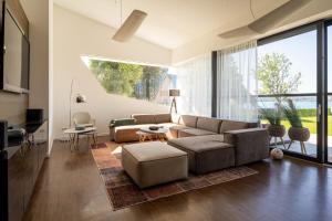 a living room with a couch and a table at Haus Sommerfrische in Weyregg