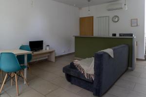 a living room with a couch and a table at Apartamente AIFEN in Eforie Nord