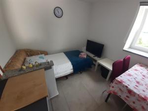 Postel nebo postele na pokoji v ubytování Apartman Sunset