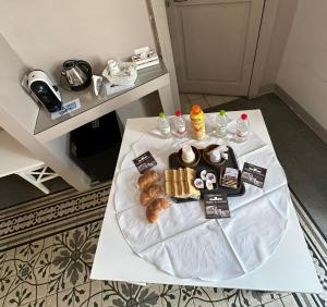 a table with a bunch of pastries on it at Matera In Vacanza in Matera