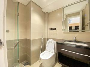 a bathroom with a toilet and a sink and a shower at NM Home Da Nang in Da Nang +42 photos