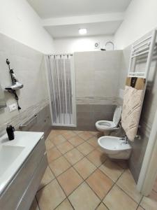 a bathroom with a toilet and a sink at B&B VILLA RITA in Silvi Marina