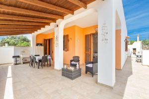 an outdoor patio with a table and chairs at Salentoandmore - Anna Rita Guest House in Marina di Leuca