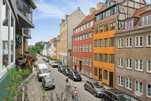 a view of a city street with cars and buildings at Great central apartment walking distance to metro in Copenhagen