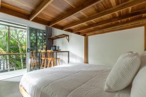 Postel nebo postele na pokoji v ubytování Ventura Santa Teresa