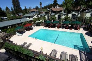 an overhead view of a swimming pool at a hotel at The Woods Hotel - Gay LGBTQ Cabins in Guerneville