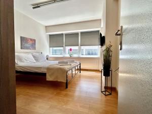 a bedroom with a bed and a window at Celeste in Volos