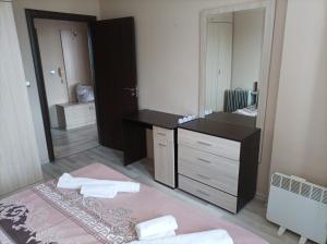 a bathroom with a vanity and a large mirror at One Bedroom Apartment 10 - Vasil Aprilov 64 Plovdiv in Plovdiv