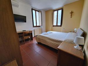 Casa per Ferie Ulivo d'Assisi客房内的一张或多张床位