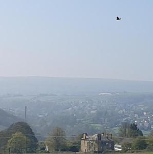 a view of a city from the top of a hill at Oakworth in Oakworth