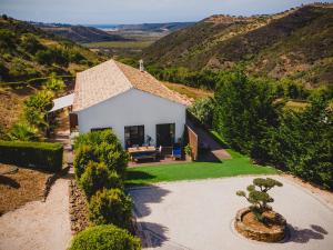an aerial view of a house with a garden at Salthouse Portugal - Stylish Duplex Apartment in Aljezur