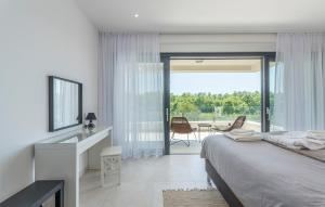 a bedroom with a bed and a sliding glass door at Villa Bianca in Novigrad Istria