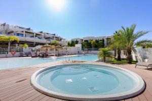 a large swimming pool in a resort at Jardinana - apartment with two bedrooms close to beach and town center in La Cala de Mijas
