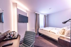 Postel nebo postele na pokoji v ubytování Premier Inn Nürnberg City Nordost