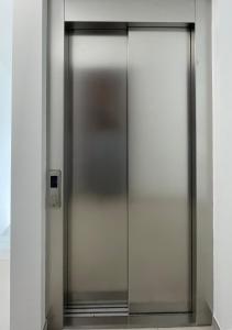 an elevator door in a building at Carissimi 4 in Milan