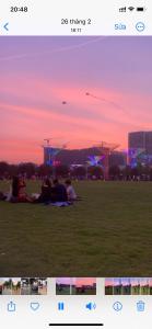 a group of people sitting in a park at sunset at Lahomestay Chỗ Nghỉ 2PN Tiện Nghi, Khách Hàng Yêu Thích in Tân Vạn +18 photos