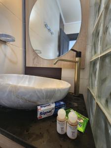 a bathroom with a sink and a mirror at FamilyConfort Saidia in Saïdia