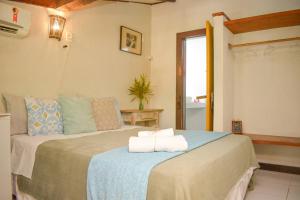 Cama ou camas em um quarto em Villa Geriba