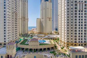 an aerial view of a city with tall buildings at Vivid 2-bedroom Marina view in Dubai