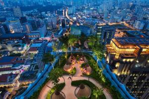 an aerial view of a city at night at Andaz Singapore A Concept by Hyatt in Singapore