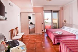 Postel nebo postele na pokoji v ubytování Hotel Le Querce
