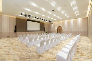 a conference room with white chairs and a screen at Best Western Plus Carapace Hotel Hua Hin in Hua Hin +140 photos