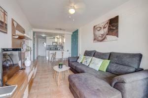 a living room with a couch and a table at Paraiso II EQ FREE WIFI in Playa Paraiso