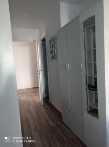 an empty room with a cabinet and a hallway at Raquel Apartament in Alicante +1 photo