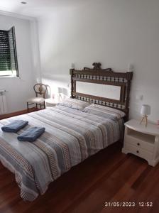 Säng eller sängar i ett rum på AR Villa Rica Apartment