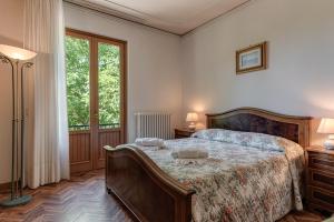 Postel nebo postele na pokoji v ubytování Gigli di Firenze
