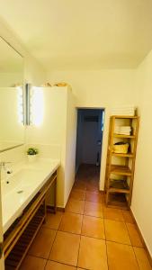 a bathroom with a sink and a mirror at Casa Nena Es Calo in Es Caló