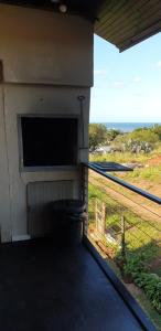 a building with a view of the ocean from a balcony at SeeBos Holiday Home in Port Edward