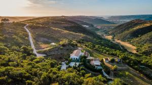 an aerial view of a house on a hill at Salthouse Portugal - Stylish Duplex Apartment in Aljezur