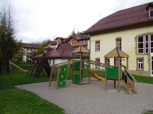 a playground with a slide at loft panorama Tre cime Dobbiaco Cortina in Dobbiaco