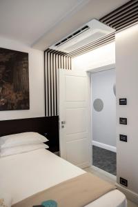 Un pat sau paturi într-o cameră la Rumi Boutique Hotels&Spa Only adults