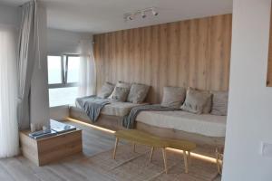 Posedenie v ubytovaní Precioso apto Miami primera linia playa cala de las Sirenas, con WIFI y NETFLIX, adecuado para teletrabajar