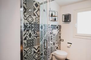 a bathroom with a toilet and a shower at Nonna Gina Country House in San Miniato Basso +19 photos