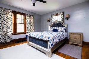 a bedroom with a large bed and a window at Cozy 5BR Home minutes from the falls in Niagara Falls
