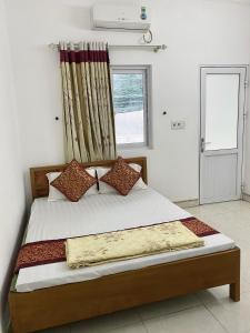 Un pat sau paturi într-o cameră la Nhà Nghỉ Mộc Châu Ecolodge