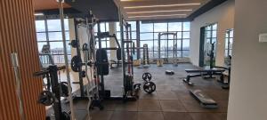 a gym with treadmills and equipment in a building at LeR Homes in Nairobi